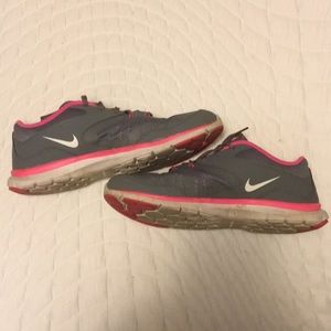 Pink and grey Nike flex’s size 7.5
